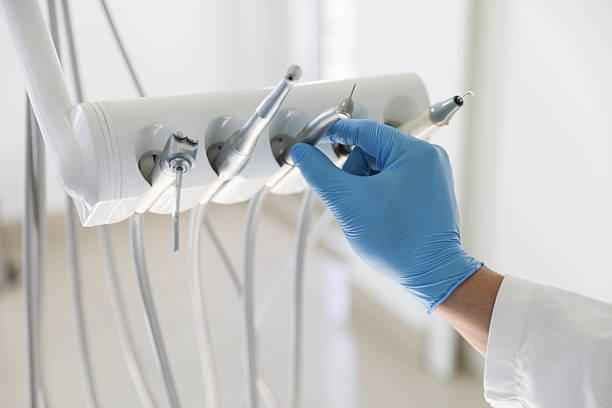 Professional Tooth Extraction technician working in Benton County County, TN